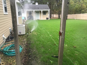 green lawn being watered