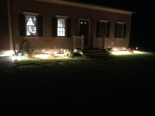 landscape lighting front of house, installed by Dependable Landscaping